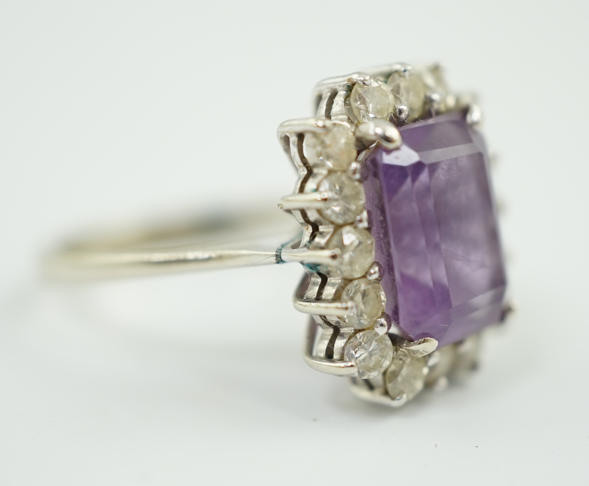 A modern white gold, amethyst and diamond set rectangular cluster ring